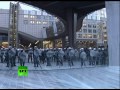 Dairy of Mad Men: Angry farmers spray milk on riot police in Brussels