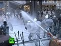 Milky Way: Infuriated farmers spray milk on riot police in Brussels