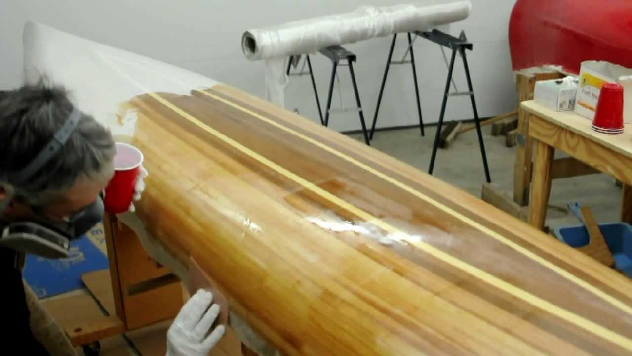 Fiberglassing a wooden kayak hull - YouTube