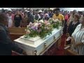 The victim of a gang rape and murder is laid to rest.