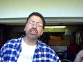 Bobby Lewis "Mr. Robert" preaches about clothing drive