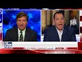 Tucker to ex-DNC official: You're lying for political gain