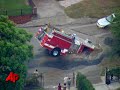 Raw Video: Sinkhole Swallows Fire Truck