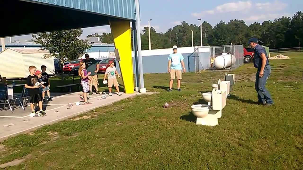 Toilet games Elementary carnival toilet paper roll tossing game into