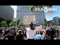 Crowds continue to march through Los Angeles in protest of Ge...