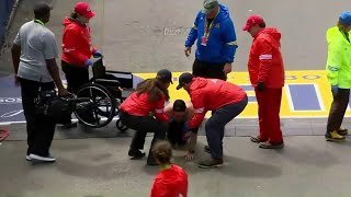 Image of marine crawling across finish line at Boston Marathon captures attention of millions