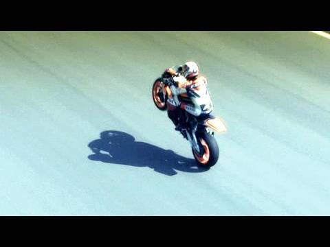 MotoGP Rider Dani Pedrosa Races Against Alejandro Maclean