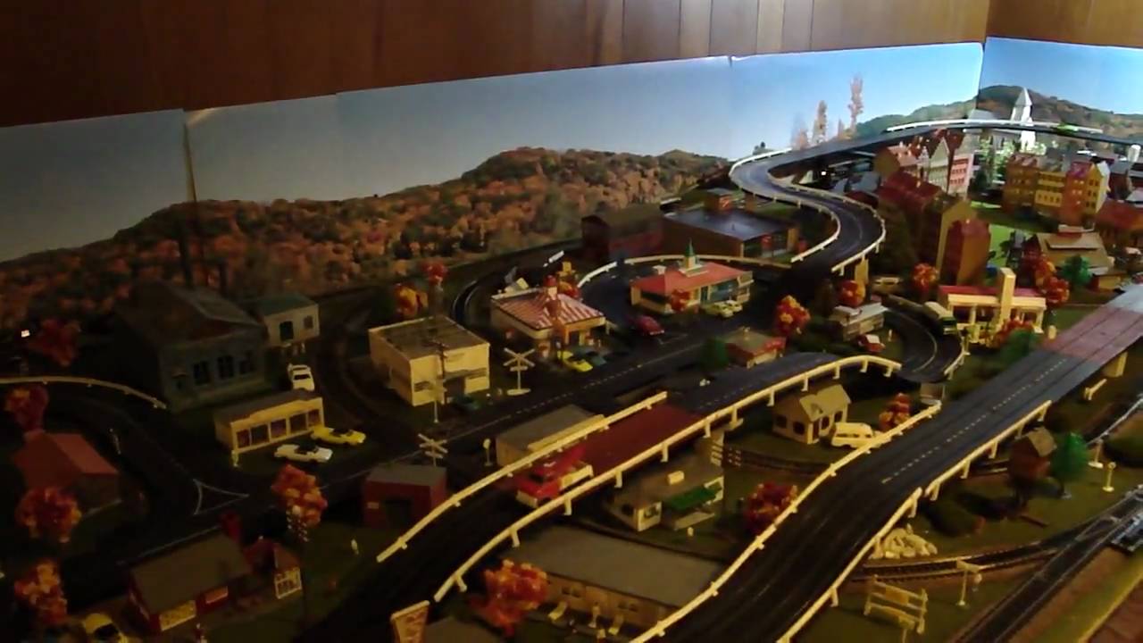 HO Train Layout and Aurora Model Motoring Race Track Lay Out - YouTube