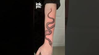 Black Ink Snake Tattoo Wrapping Forearm