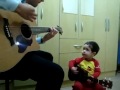 Baby boy playing Don't Let Me Down on the guitar with his dad.