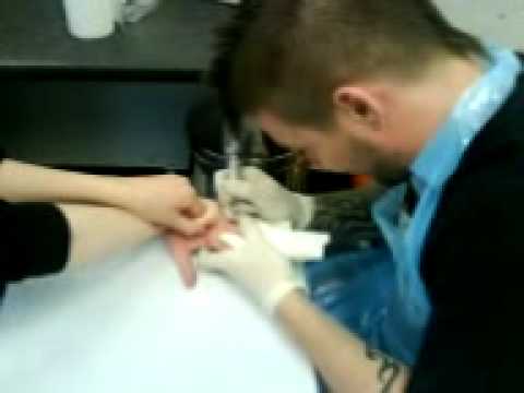 Me getting the inside of my finger tattooed