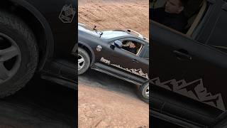 Porsche Cayenne Climbing Up The Hill In Moab
