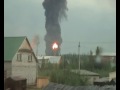 Massive oil tank explosion filmed from 2 km away