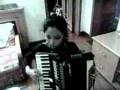 Chinese lovely schoolgirl plays accordion
