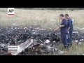 Workers Search Malaysian Plane Wreckage