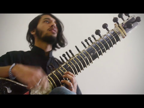 Musician playing Animals as Leaders sitar cover