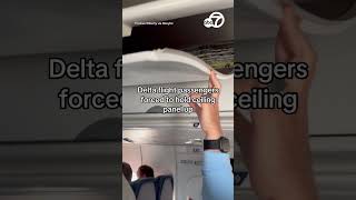 Delta Flight Pengers Forced To Hold Ceiling Panel Up