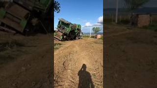Tractor Overturns Giant Combine Harvester On Truck