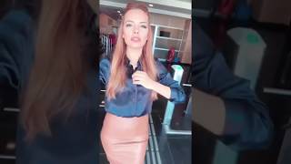 Deniz Satar In Satin Blouse And Leather Skirt