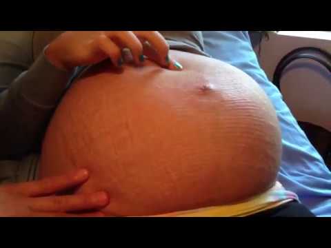 Camgirl pregnant belly movements