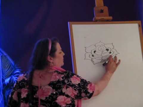 Kim Brennan of Hasina Mehndi demonstrates how to draw a henna rose at the 