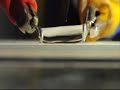 Cutting a water droplet using a superhydrophobic knife