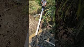 Farmer Operating Large Pipe In The Field To Solve Irrigation Problems