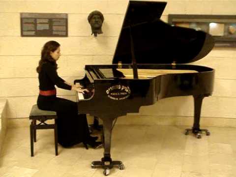 Attorney Inna Fershteyn playing piano during Young Leadership Conference in Inter Disciplinary Center (IDC) Herzlya, Israel, 2009, trip organized by AJC and Nativ