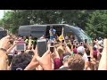 LeBron James returns home to a large crowd of people near his...