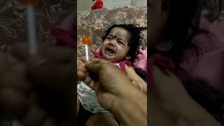 Small Baby Girl Eating Lollipop