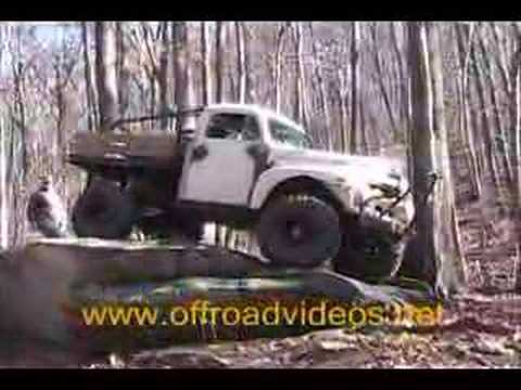 1951 Ford truck crawling on a big rock at Crab Tree Falls