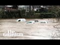 Storm Dennis: cars swept away by flooding in Wales