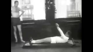 Vintage Video Of Joseph Pilates Demonstrating Some Of His Mat Exercises To A Client