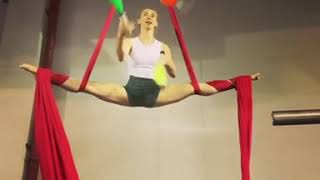 Woman Does Split While Hanging From Aerial Silks And Juggles - 1136232-2