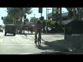 WATCH: The Bikini Man Ridding his Bicycle