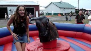Sabrina on mechanical bull with a little upskirt action