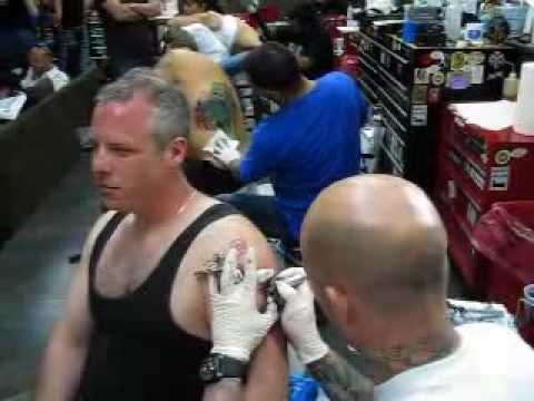 Ami James does a pinup skull roses at the South Beach tattoo shop