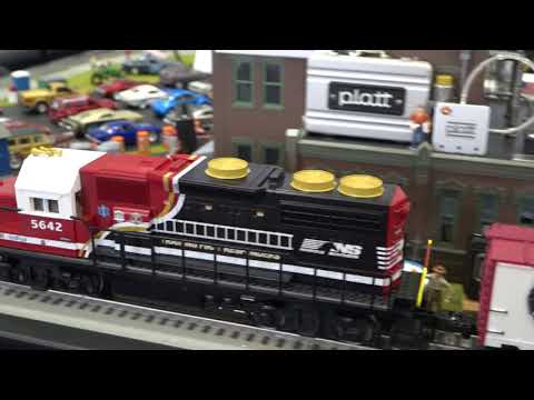 Lighthouse O-Scale Model Train Display Explanation to FAQ's from booth visitors.