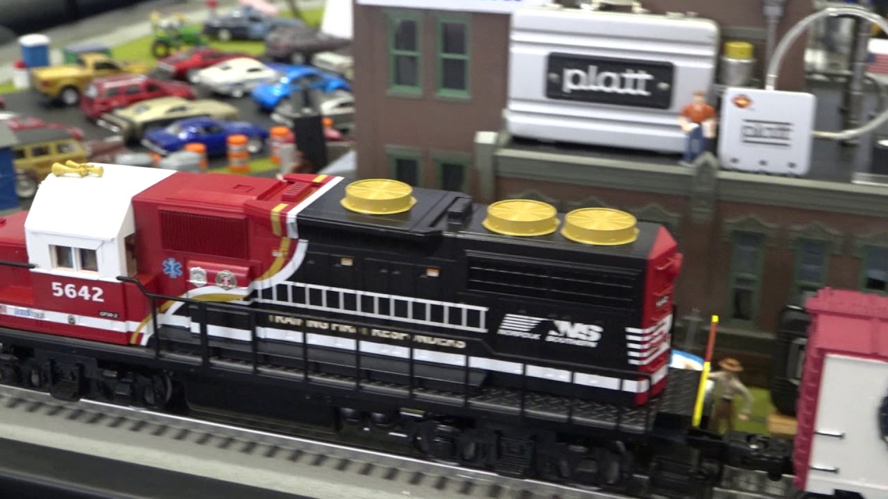 Lighthouse O-Scale Model Train Display Explanation to FAQ's from booth visitors.