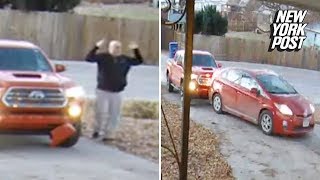 Wife backs car into husband in home driveway | New York Post