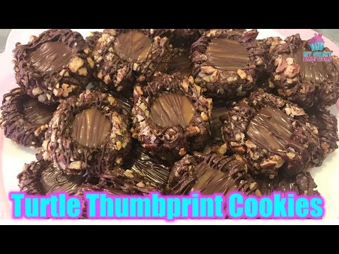 VIDEO : turtle thumbprint cookies - 1 1/2 cup plain flour 1/4 tsp baking powder 1/4 tsp salt 1/3 cup dutch process cocoa powder 1/2 cup butter 1 tsp vanilla 11 1/2 cup plain flour 1/4 tsp baking powder 1/4 tsp salt 1/3 cup dutch process c ...