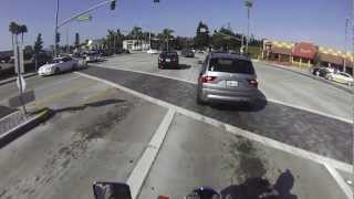 Motorcyclist Startles Driver For Running Red Light