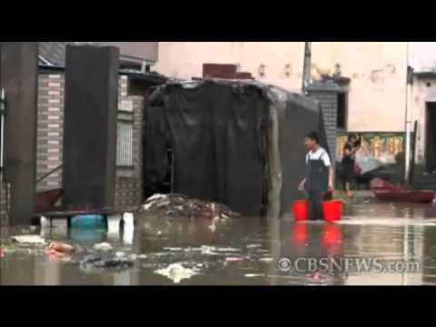 Villagers return after China floods displace millions