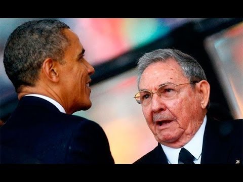 Obama, Castro chat about opening embassies in step to normal ties.