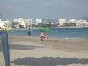 bora bora beach man in green tights