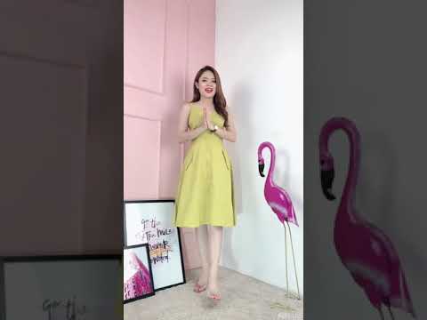 Đầm xòe sát nách phối nút