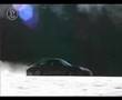 Porsche 911 racing and drifting on snow at the Nordschleife