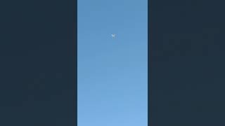 Airplane Overflying The Comercial Center