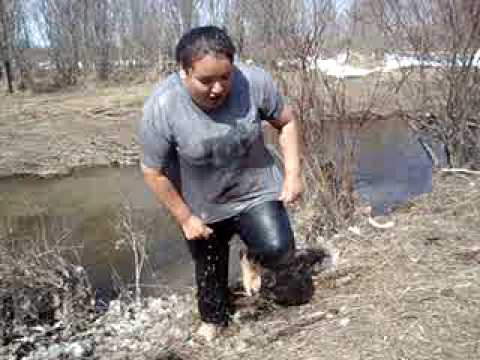 Justine jumping into frigid creek water