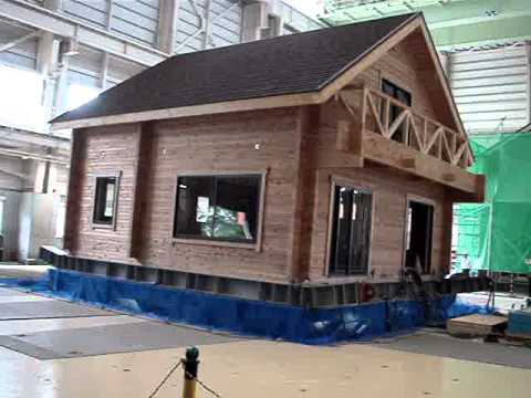 Log house on earthquake test - YouTube